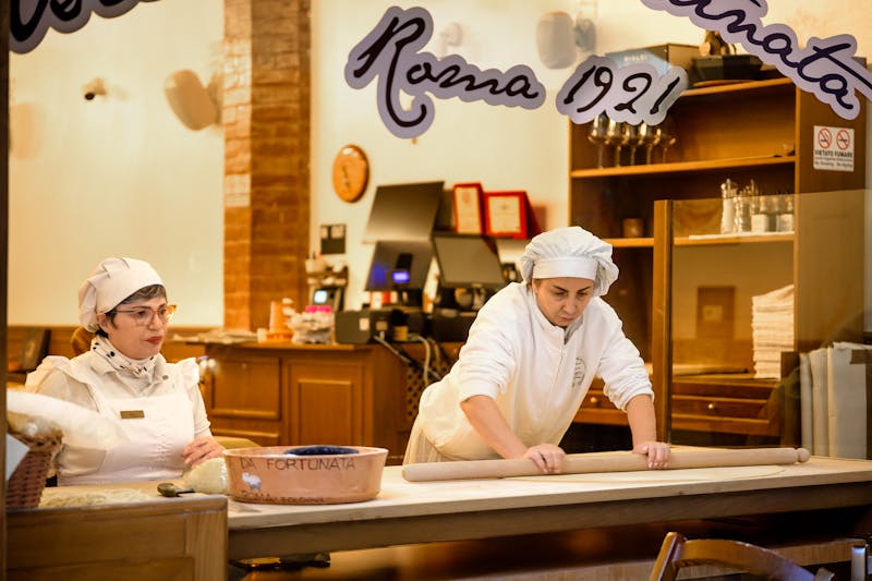 Anthony's Coal Fired Pizza team working together in the kitchen